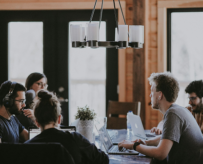 The NotionHealth team working together around a table
